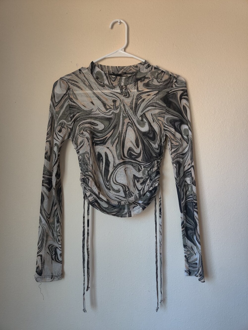 Swirl mesh long sleeve top with side ties